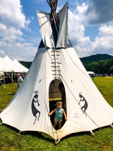 Toddler having fun in the Teepee