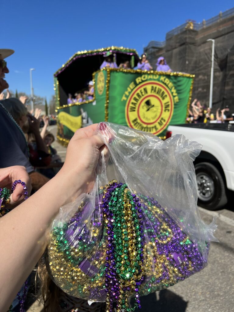 Mardi Gras Parade Throw: An ENTIRE bag of beads.