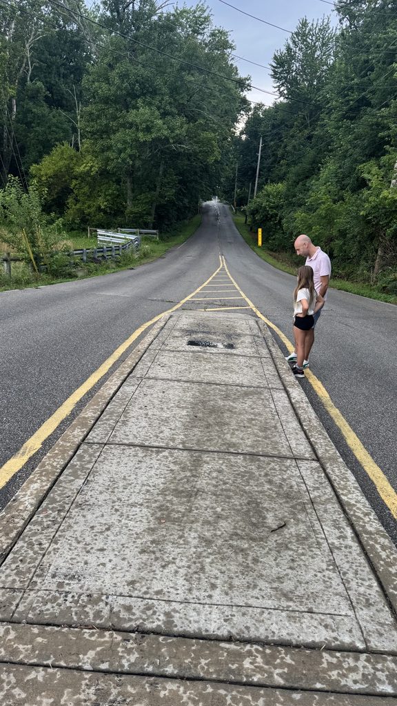 Bizarre roadside attraction: Grave in the middle of the road 