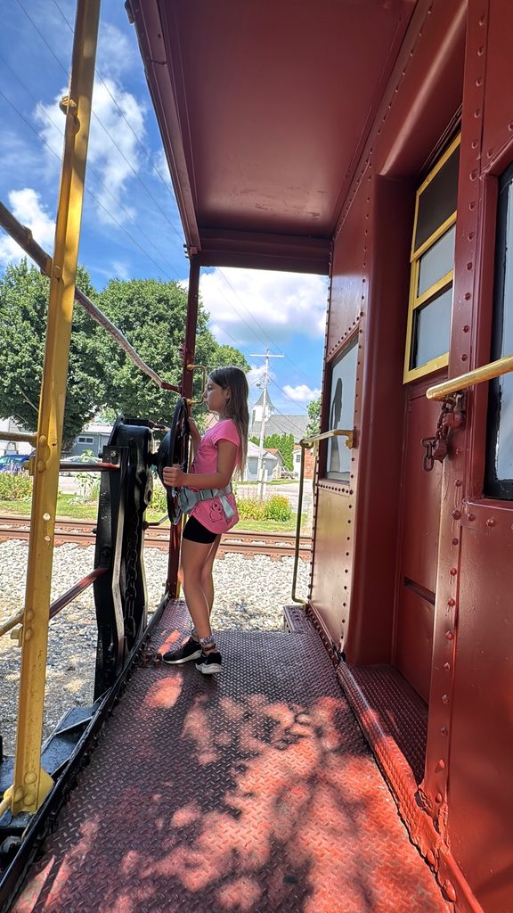 Visit the caboose across the tracks!